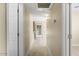 Clean hallway with light wood flooring and access to rooms at 5995 N 78Th St # 2050, Scottsdale, AZ 85250
