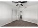 Bright bedroom with ceiling fan and carpet flooring at 7036 W Georgia Ave, Glendale, AZ 85303