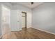 Vacant bedroom with wood-look flooring, ceiling fan, and closet at 846 W Kroll Ave, Gilbert, AZ 85233