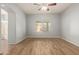 Empty bedroom with wood-look flooring and a ceiling fan at 846 W Kroll Ave, Gilbert, AZ 85233