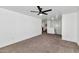 Living room with carpet and access to upper level at 8758 E Lakeview Ave, Mesa, AZ 85209