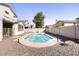 Private fenced backyard featuring a sparkling pool and gravel landscaping at 8775 W Lane Ave, Glendale, AZ 85305