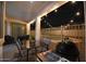 Backyard oasis with pool, patio furniture, string lights, and grill at 8775 W Lane Ave, Glendale, AZ 85305