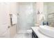 Clean, updated bathroom featuring marble tile and modern fixtures at 8775 W Lane Ave, Glendale, AZ 85305