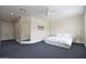 Spacious bedroom featuring a king-size bed and a full-length mirror at 8775 W Lane Ave, Glendale, AZ 85305