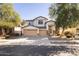 Attractive two-story home featuring a three-car garage and a well-maintained yard at 8775 W Lane Ave, Glendale, AZ 85305