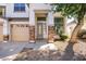 Close-up view of the home's entrance, showcasing the brick accents and inviting walkway at 8775 W Lane Ave, Glendale, AZ 85305