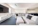 Loft area with sectional sofa, TV, and railing overlooking lower level at 8775 W Lane Ave, Glendale, AZ 85305