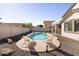 A backyard oasis complete with a pool, lounge chairs, and surrounding patio at 8775 W Lane Ave, Glendale, AZ 85305