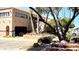 Community Clubhouse entrance with desert landscaping and palm trees at 99 S Kaoline Dr, Apache Junction, AZ 85119