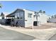 View of the home's exterior showcasing the street sign and community setting at 99 S Kaoline Dr, Apache Junction, AZ 85119