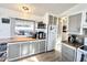 Bright kitchen with plenty of storage, white appliances, and natural light at 99 S Kaoline Dr, Apache Junction, AZ 85119