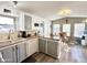 Well-designed kitchen with wood-look flooring, lots of cabinets, and a dining area at 99 S Kaoline Dr, Apache Junction, AZ 85119