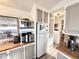 Kitchen with white appliances, ample cabinets, and a window overlooking the outdoors at 99 S Kaoline Dr, Apache Junction, AZ 85119