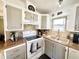 Compact kitchen featuring two-tone cabinets, modern appliances, and ample counter space at 99 S Kaoline Dr, Apache Junction, AZ 85119