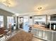 Open-concept kitchen with sliding glass door access to a private outdoor deck at 99 S Kaoline Dr, Apache Junction, AZ 85119