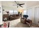 Comfortable living space with ample seating, ceiling fan, and natural light from nearby window at 99 S Kaoline Dr, Apache Junction, AZ 85119