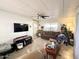 Living room featuring comfortable furniture, a large TV, and decorative accents at 99 S Kaoline Dr, Apache Junction, AZ 85119