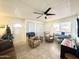 Cozy living room with comfortable seating, a ceiling fan, and a keyboard at 99 S Kaoline Dr, Apache Junction, AZ 85119