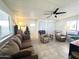 Inviting living room with a ceiling fan, cozy furniture, and natural light at 99 S Kaoline Dr, Apache Junction, AZ 85119