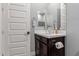 Clean bathroom with dark vanity and white countertop at 10157 E Texas Ave, Mesa, AZ 85212