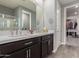 Modern bathroom with double vanity, large mirror and walk-in shower at 10157 E Texas Ave, Mesa, AZ 85212