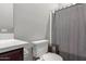 Bathroom with shower, toilet, and gray curtain at 10157 E Texas Ave, Mesa, AZ 85212