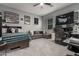 Spacious bedroom with bed, couch, and workspace at 10157 E Texas Ave, Mesa, AZ 85212