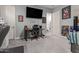 Bedroom with desk, chair, and large TV at 10157 E Texas Ave, Mesa, AZ 85212