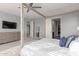 Spacious primary bedroom with a large bed, dresser, and walk-in closet at 10157 E Texas Ave, Mesa, AZ 85212