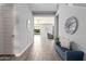 Open entryway with tile floors, bench seating, and view to living room at 10157 E Texas Ave, Mesa, AZ 85212