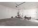 Garage with epoxy flooring and home gym equipment at 10157 E Texas Ave, Mesa, AZ 85212
