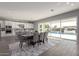 Modern kitchen with white cabinets, center island, and backyard access at 10157 E Texas Ave, Mesa, AZ 85212