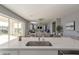 Open concept kitchen and Gathering room with large island and view to backyard at 10157 E Texas Ave, Mesa, AZ 85212
