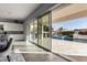 View from kitchen to backyard with sparkling pool and patio at 10157 E Texas Ave, Mesa, AZ 85212