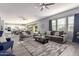 Open living room and kitchen with tile floors and ample natural light at 10157 E Texas Ave, Mesa, AZ 85212