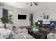 Cozy living room with gray sofas, a coffee table, and tasteful decor at 10157 E Texas Ave, Mesa, AZ 85212