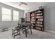Spacious home office with a large desk and extensive book shelving at 10157 E Texas Ave, Mesa, AZ 85212