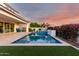 Inviting pool and patio with a view of the home's exterior at 10157 E Texas Ave, Mesa, AZ 85212
