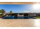 Inviting pool and patio with serene views and landscaping at 10157 E Texas Ave, Mesa, AZ 85212