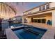 Luxury pool and spa with a covered patio and seating area at 10157 E Texas Ave, Mesa, AZ 85212