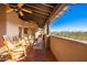 Covered balcony with rocking chairs and mountain views at 15155 E Westridge Dr, Fountain Hills, AZ 85268