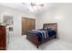 Bedroom with wood bed frame and ceiling fan at 15155 E Westridge Dr, Fountain Hills, AZ 85268