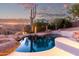 Inviting pool with a tranquil desert landscape at sunset at 15155 E Westridge Dr, Fountain Hills, AZ 85268