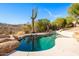 Sparkling pool surrounded by desert landscaping at 15155 E Westridge Dr, Fountain Hills, AZ 85268