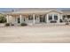 House exterior with large covered patio and desert landscape at 16068 W Edgemont Ave, Goodyear, AZ 85395