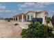 Home's backyard with patio, grill, and landscaping at 16068 W Edgemont Ave, Goodyear, AZ 85395