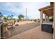 Spacious backyard patio with built-in grill and golf course views at 16068 W Edgemont Ave, Goodyear, AZ 85395