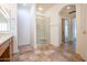 Bathroom boasts a walk-in shower and updated fixtures at 16068 W Edgemont Ave, Goodyear, AZ 85395