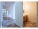 Small bathroom with wood vanity and tiled flooring at 16068 W Edgemont Ave, Goodyear, AZ 85395
